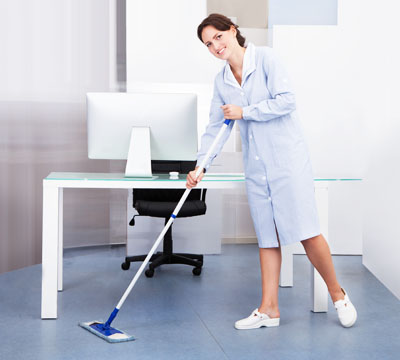 Female cleaner performing Office Cleaning using a mop